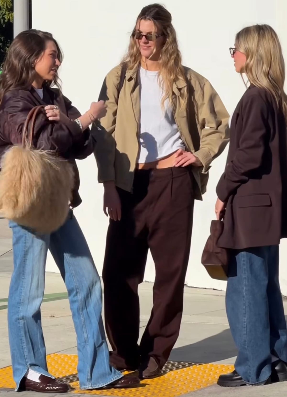 Brown bomber jacket with a fur bag, khaki jacket with brown pants, and a brown blazer.
