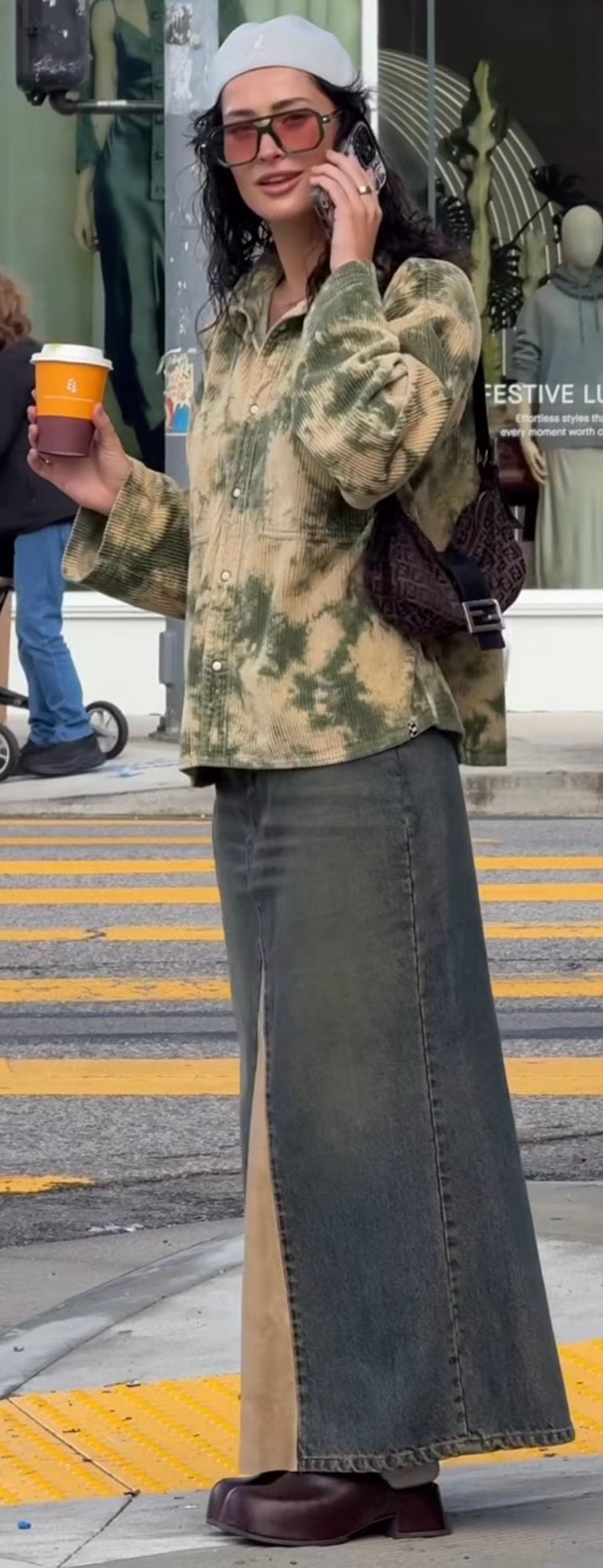 White beret, oversized tie-dye corduroy shirt, long denim skirt, brown clogs, and Fendi bag.