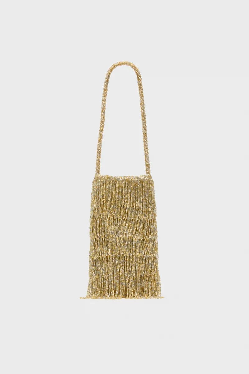 Gold beaded fringe shoulder bag with a long strap.