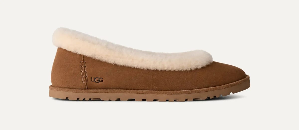 Brown UGG slipper with cream fluffy trim.