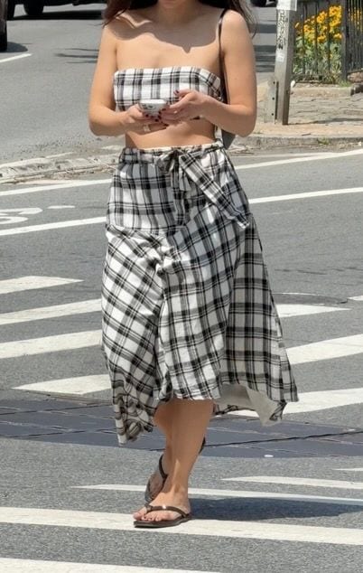 Black and white plaid strapless top and matching high-low skirt with a tie-waist.