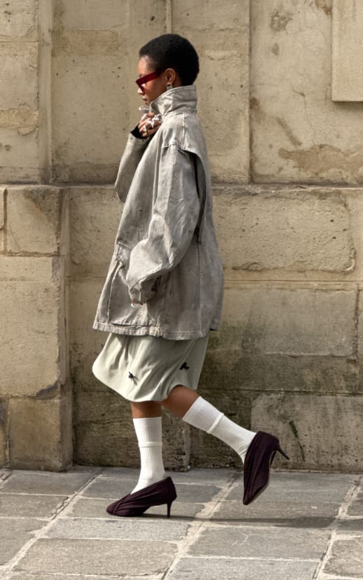Gray washed jacket, light green shorts, white socks, and purple heels.