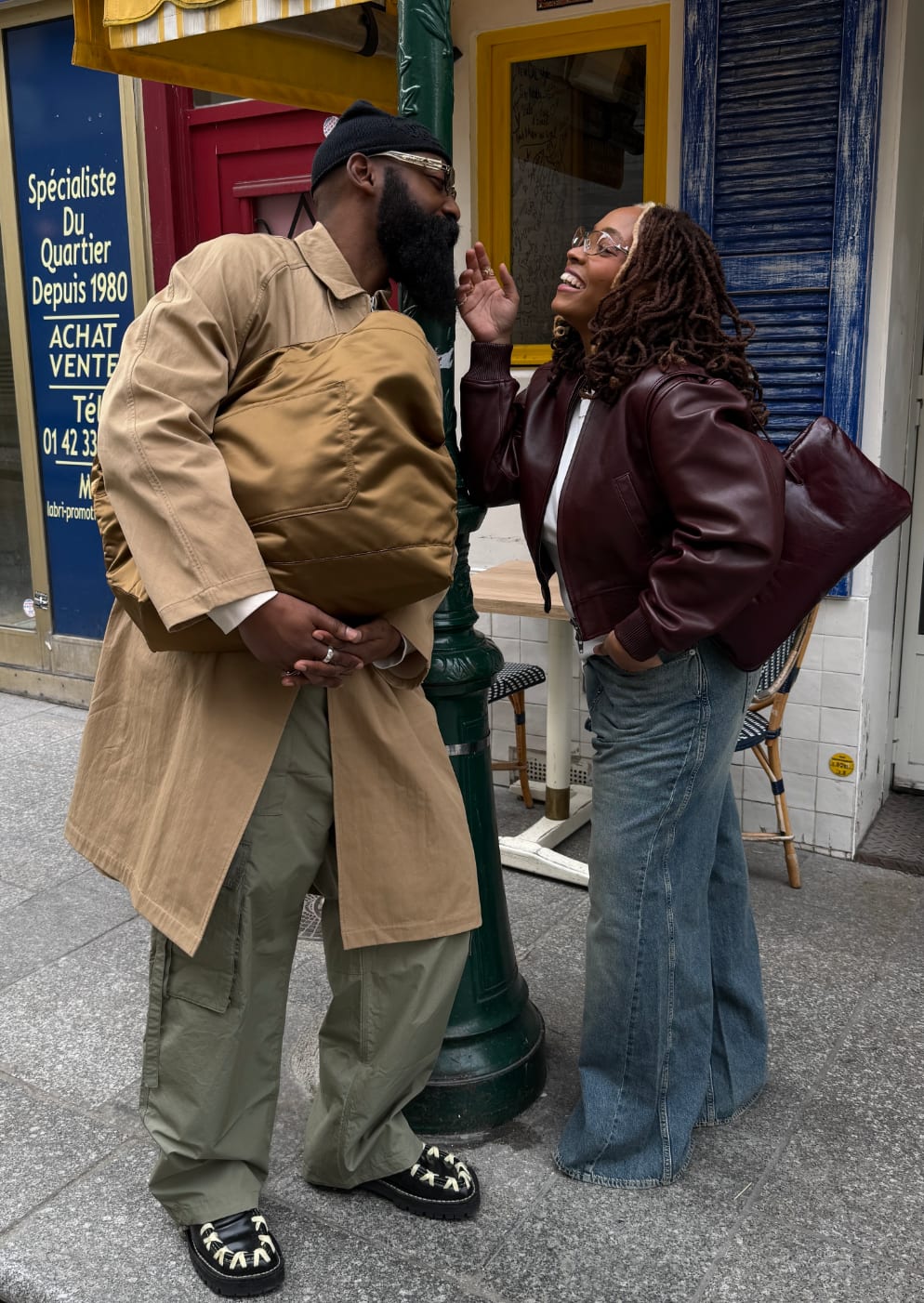 Tan trench coat, olive cargo pants, and black moccasins. Maroon leather bomber jacket and jeans.