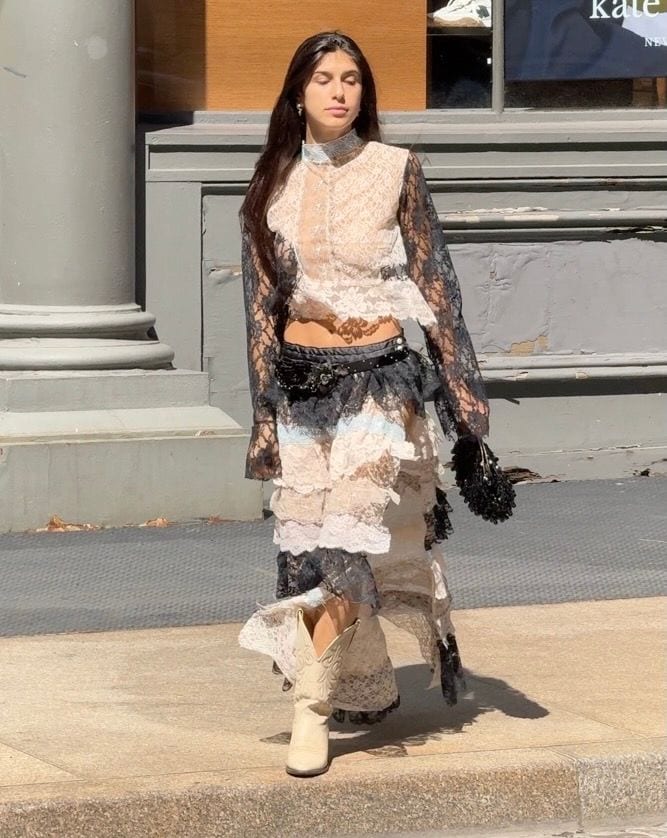 Lace blouse and tiered lace skirt, paired with cream cowboy boots.