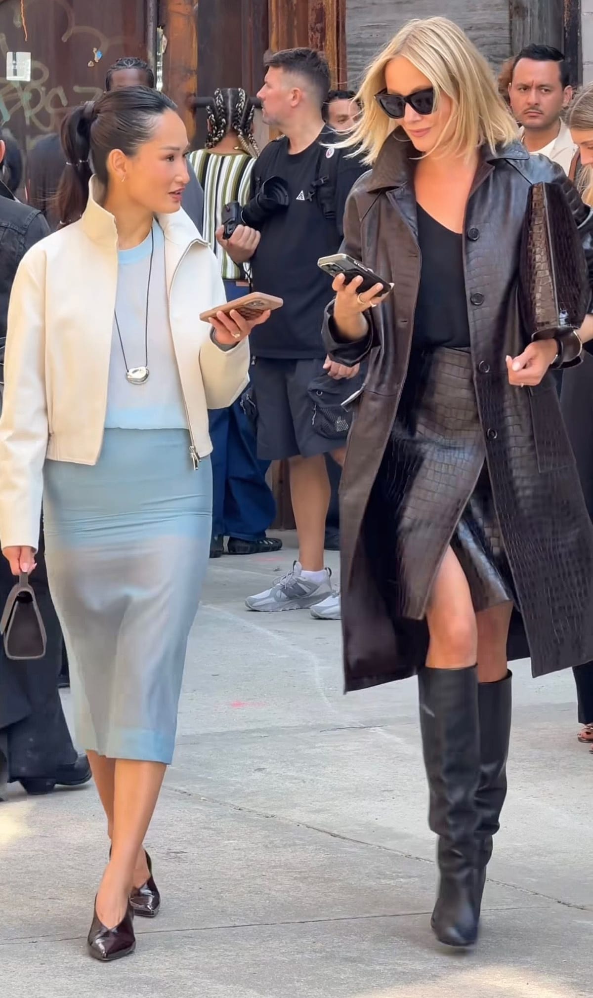 Beige jacket, light blue dress, and black heels contrasted with dark brown leather coat, skirt, and boots.