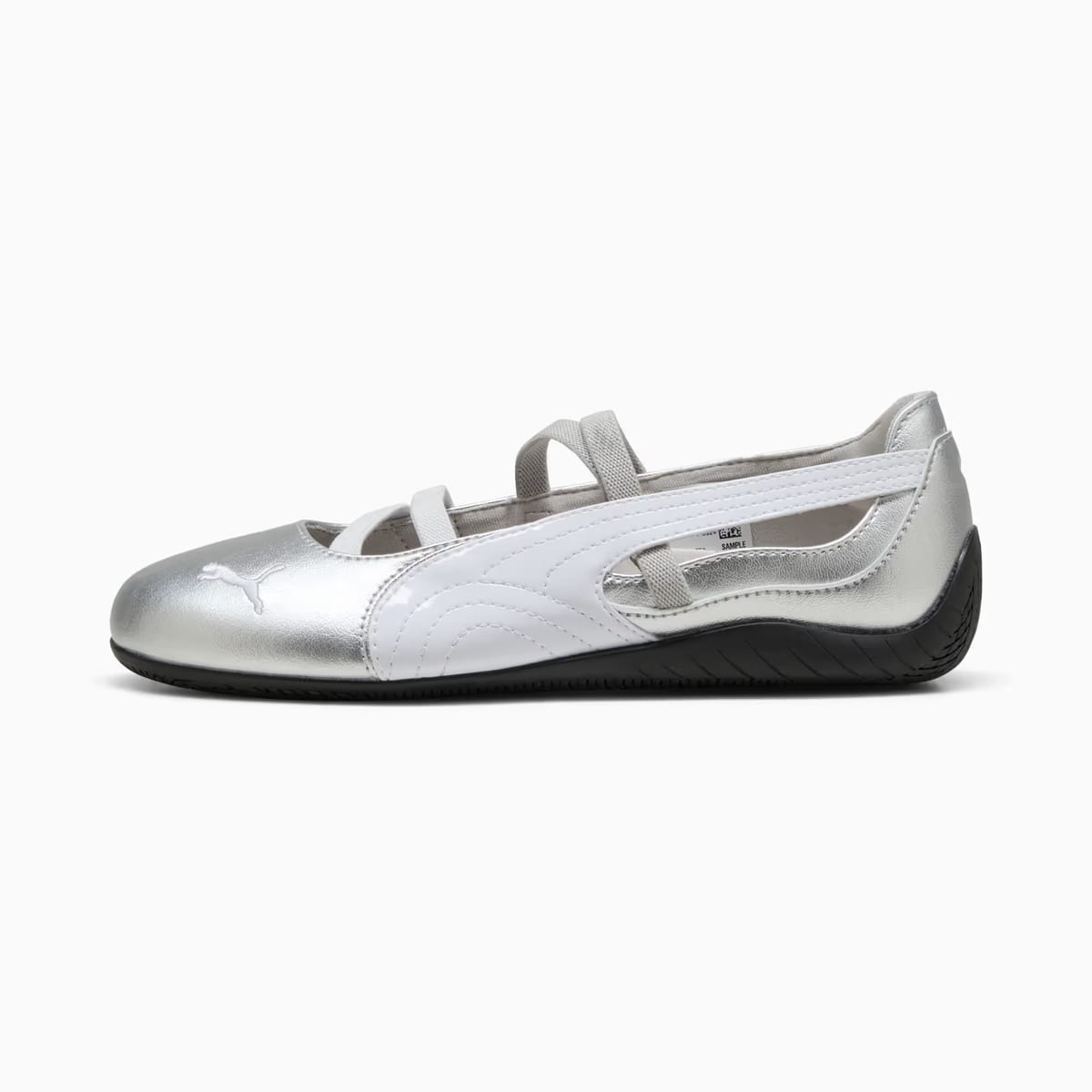Silver ballet flat with white accents and Puma logo on a white background.