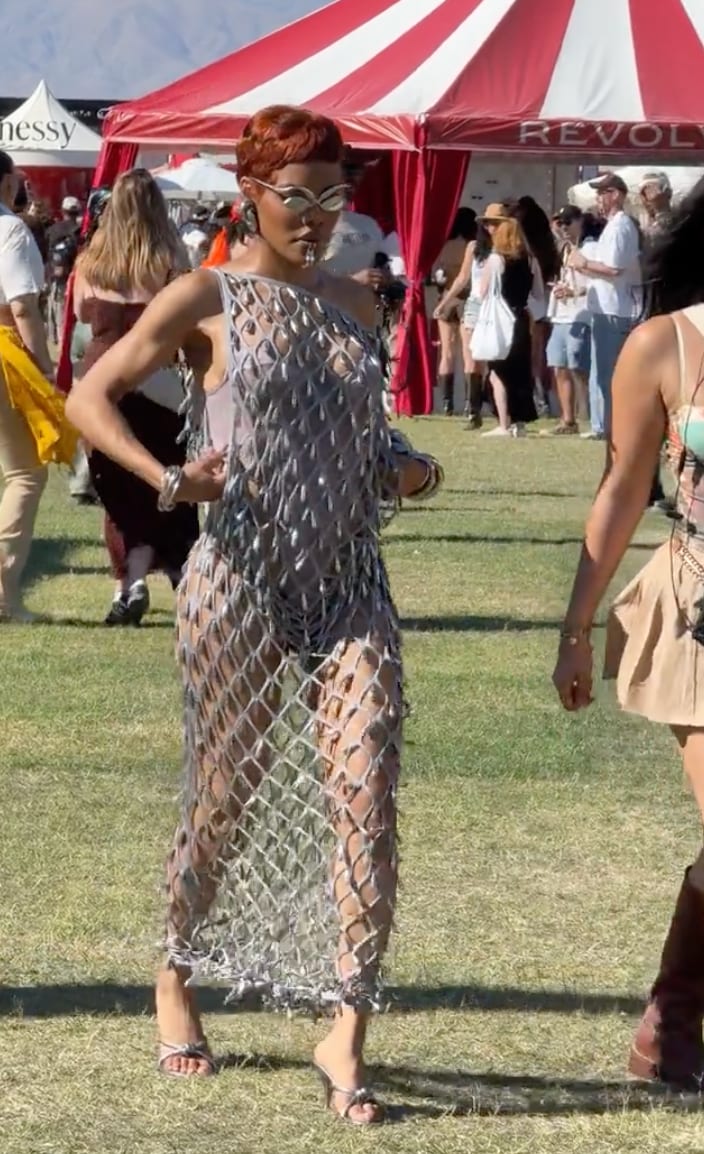 Silver fishnet dress with mirrored sunglasses and bronze hair at an outdoor festival.