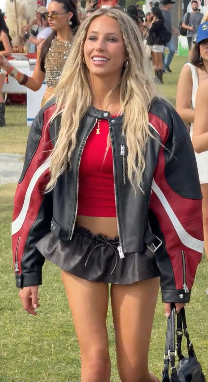 Red cropped top, black and red leather moto jacket, black ruched mini skirt.